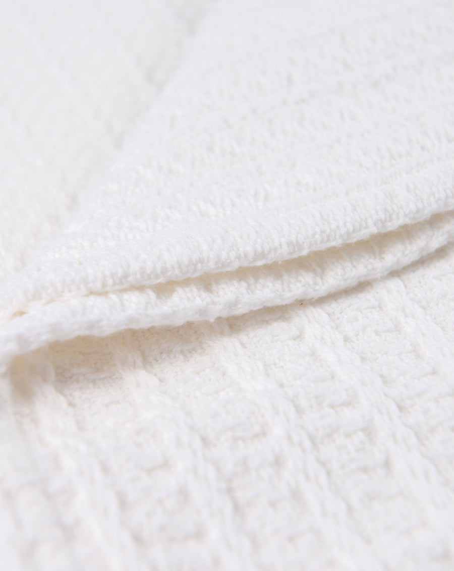 Add comfort to any corner with this cloud-soft throw blanket.